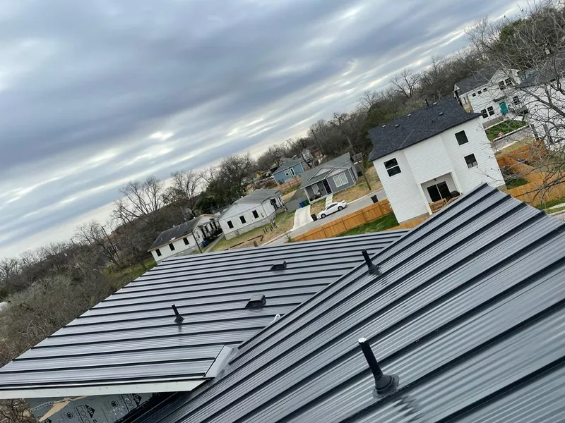 Standing seam metal roof panels with vents for Skylight Repair in Scarsdale